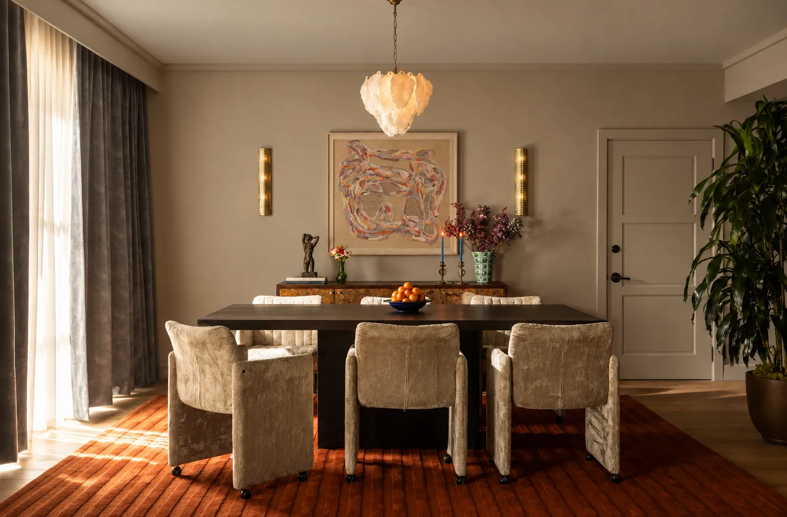 A hotel dining room with a large abstract artwork on the wall